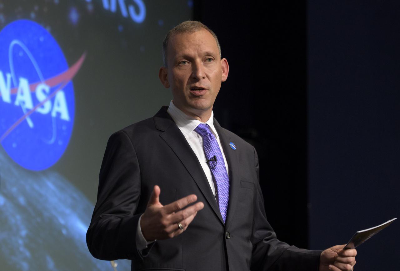 NASA Associate Administrator for the Science Mission Directorate, Thomas Zurbuchen, answers questions during an event where nine U.S. companies where named as eligible to bid on NASA delivery services to the lunar surface through Commercial Lunar Payload Services (CLPS) contracts, Thursday, Nov. 29, 2018 at NASA Headquarters in Washington. The companies will be able to bid on delivering science and technology payloads for NASA, including payload integration and operations, launching from Earth and landing on the surface of the Moon. NASA expects to be one of many customers that will use these commercial landing services. Photo Credit: (NASA/Bill Ingalls)