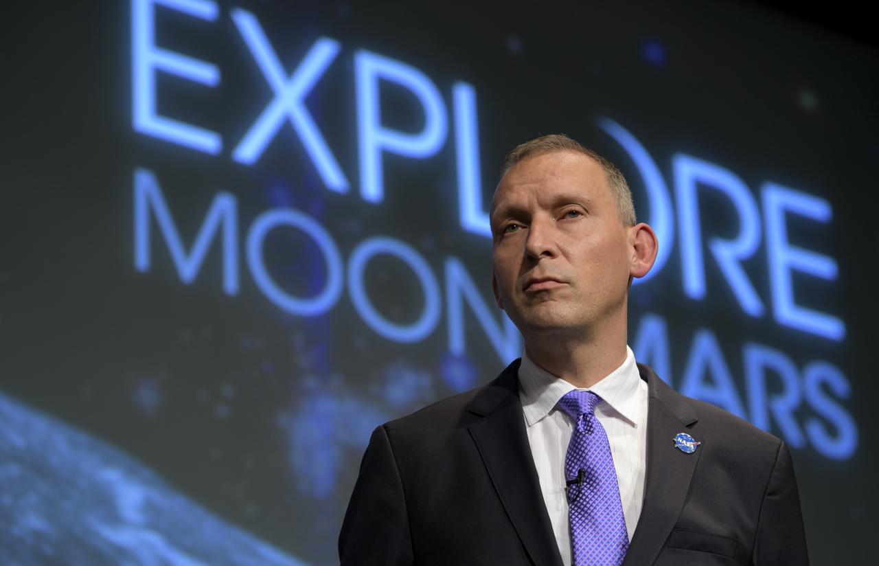 NASA Associate Administrator for the Science Mission Directorate, Thomas Zurbuchen, answers questions during an event where nine U.S. companies where named as eligible to bid on NASA delivery services to the lunar surface through Commercial Lunar Payload Services (CLPS) contracts, Thursday, Nov. 29, 2018 at NASA Headquarters in Washington. The companies will be able to bid on delivering science and technology payloads for NASA, including payload integration and operations, launching from Earth and landing on the surface of the Moon. NASA expects to be one of many customers that will use these commercial landing services. Photo Credit: (NASA/Bill Ingalls)