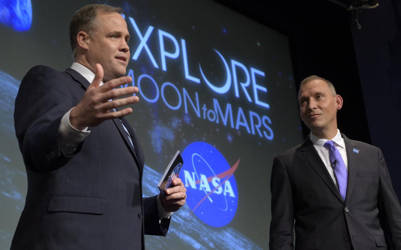 NASA Administrator Jim Bridenstine, left, and NASA Associate Administrator for the Science Mission Directorate, Thomas Zurbuchen, answer questions during an event where nine U.S. companies where named as eligible to bid on NASA delivery services to the lunar surface through Commercial Lunar Payload Services (CLPS) contracts, Thursday, Nov. 29, 2018 at NASA Headquarters in Washington. The companies will be able to bid on delivering science and technology payloads for NASA, including payload integration and operations, launching from Earth and landing on the surface of the Moon. NASA expects to be one of many customers that will use these commercial landing services. Photo Credit: (NASA/Bill Ingalls)