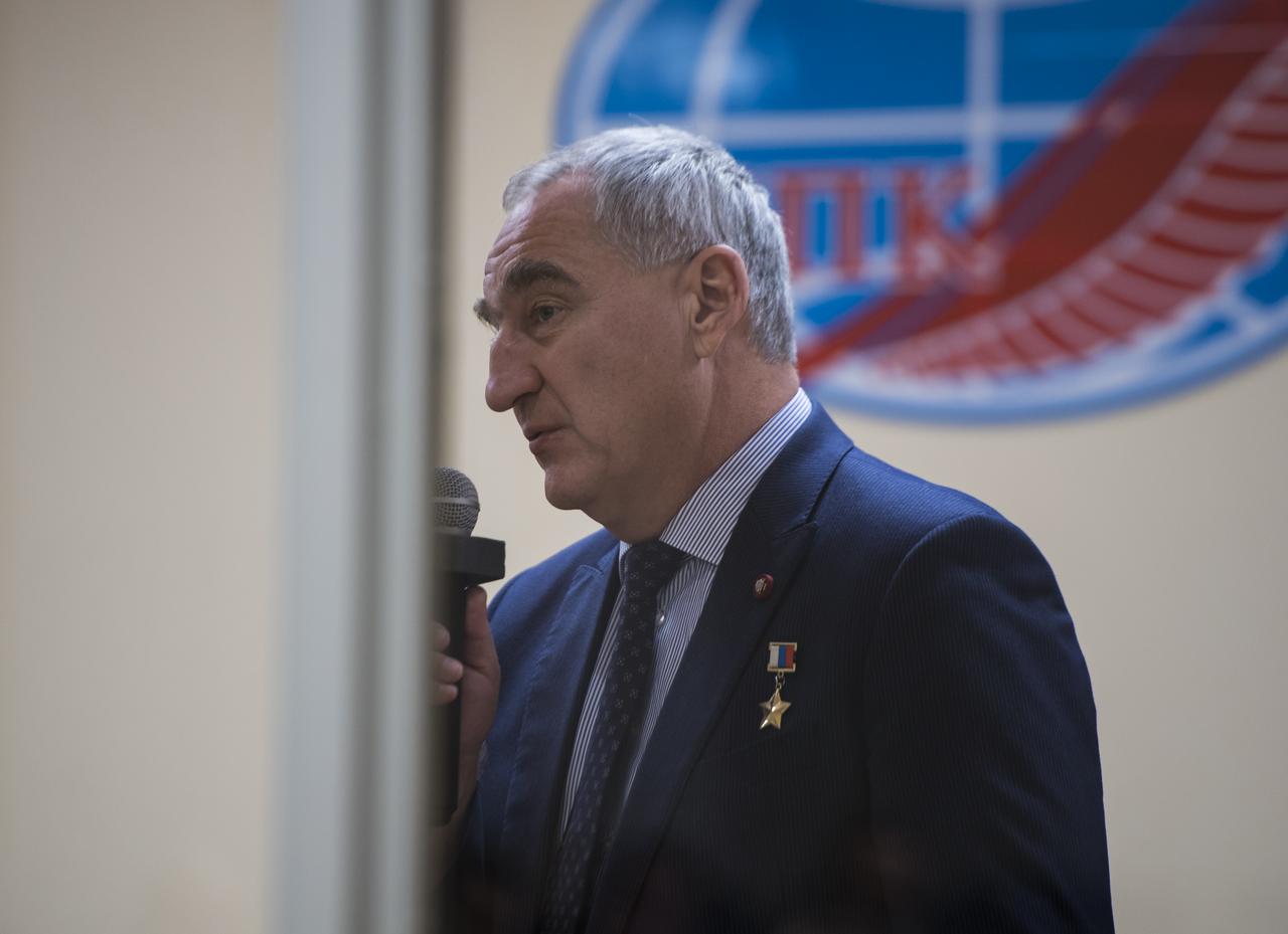 Expedition 58 backup crew member, Soyuz Commander Alexander Skvortsov of Roscosmos, speaks from behind glass, while in quarantine, during the State Commission meeting to approve the Soyuz launch of Expedition 58 to the International Space Station, Sunday, Dec. 2, 2018 at the Cosmonaut Hotel in Baikonur, Kazakhstan. Launch of the Soyuz rocket is scheduled for Dec. 3 and will carry Soyuz Commander Oleg Kononenko, Flight Engineer Anne McClain of NASA, and Flight Engineer David Saint-Jacques of the Canadian Space Agency (CSA) into orbit to begin their six and a half month mission on the International Space Station. Photo Credit: (NASA/Aubrey Gemignani).