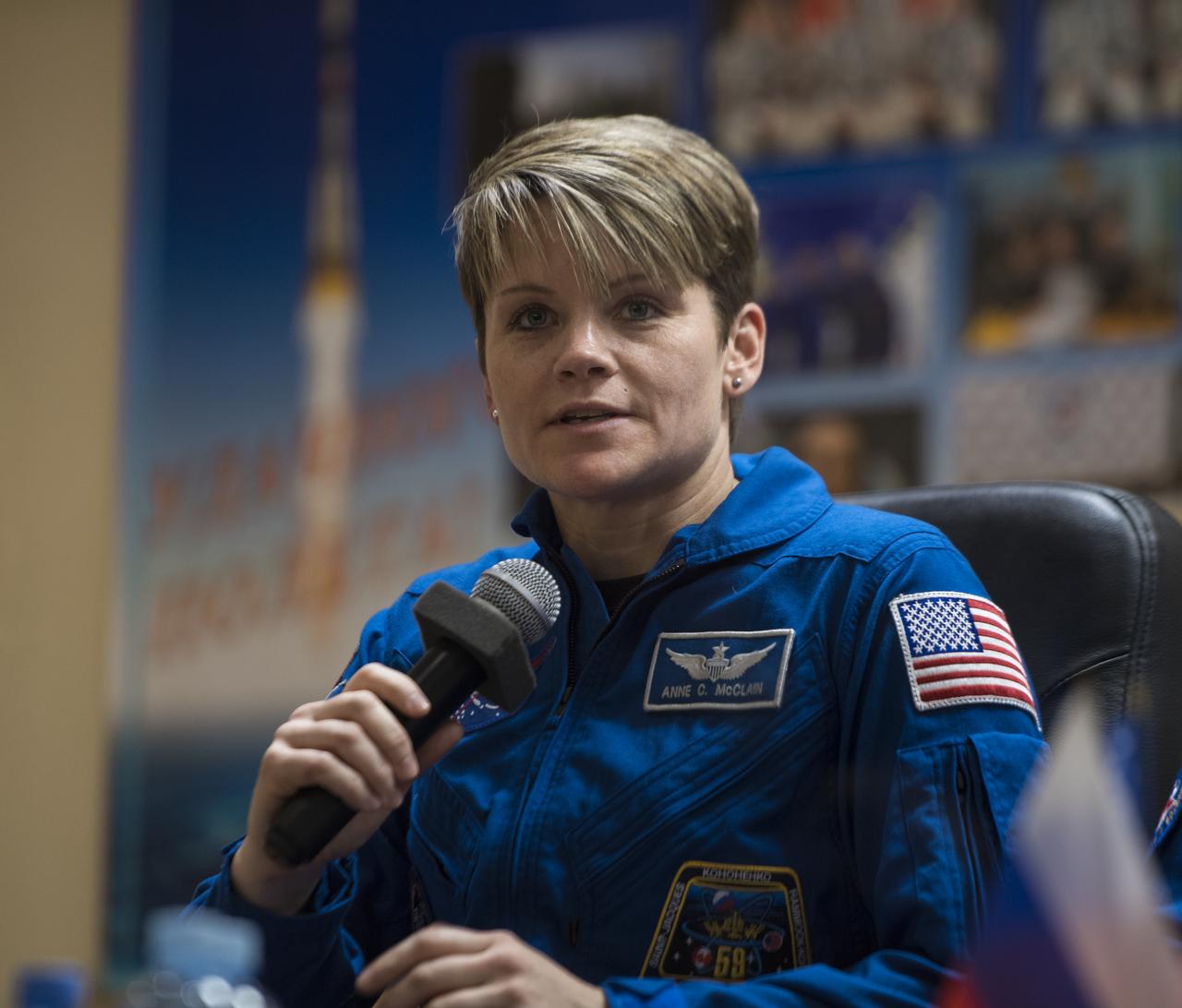 Expedition 58 Flight Engineer Anne McClain of NASA, answers a question during a press conference, Sunday, Dec. 2, 2018 at the Cosmonaut Hotel in Baikonur, Kazakhstan. Launch of the Soyuz rocket is scheduled for Dec. 3 and will carry McClain, Soyuz Commander Oleg Kononenko of Roscosmos, and Flight Engineer David Saint-Jacques of the Canadian Space Agency (CSA) into orbit to begin their six and a half month mission on the International Space Station. Photo Credit: (NASA/Aubrey Gemignani).