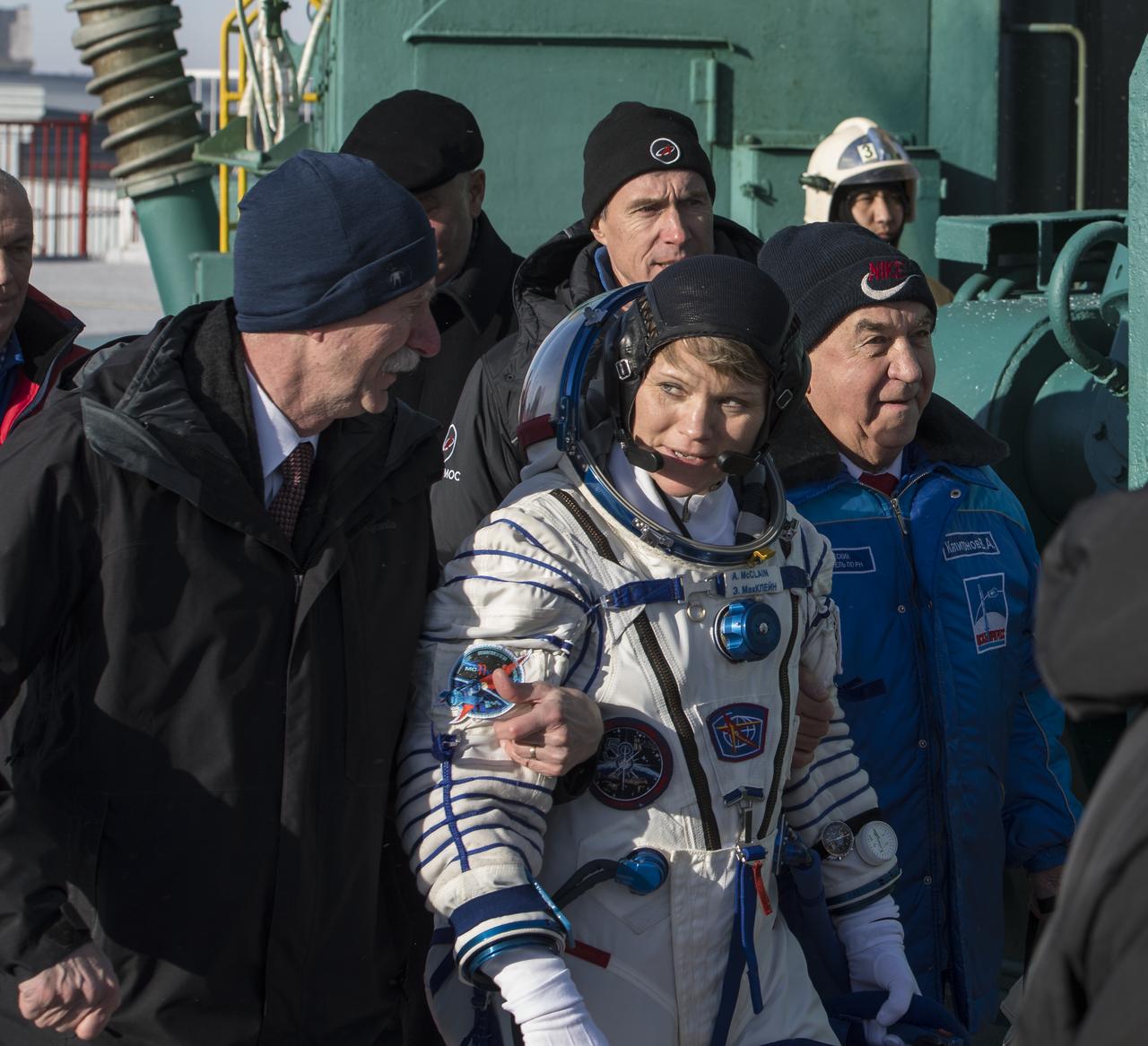 Expedition 58 Flight Engineer Anne McClain of NASA is walked to the Soyuz vehicle for launch by Bill Gerstenmaier, associate administrator, Human Exploration and Operations, NASA, left, Monday, Dec. 3, 2018 in Baikonur, Kazakhstan. McClain, Flight Engineer David Saint-Jacques of the Canadian Space Agency (CSA), and Soyuz Commander Oleg Kononenko of Roscosmos, will spend the next six and a half months onboard the International Space Station. Photo Credit: (NASA/Aubrey Gemignani)