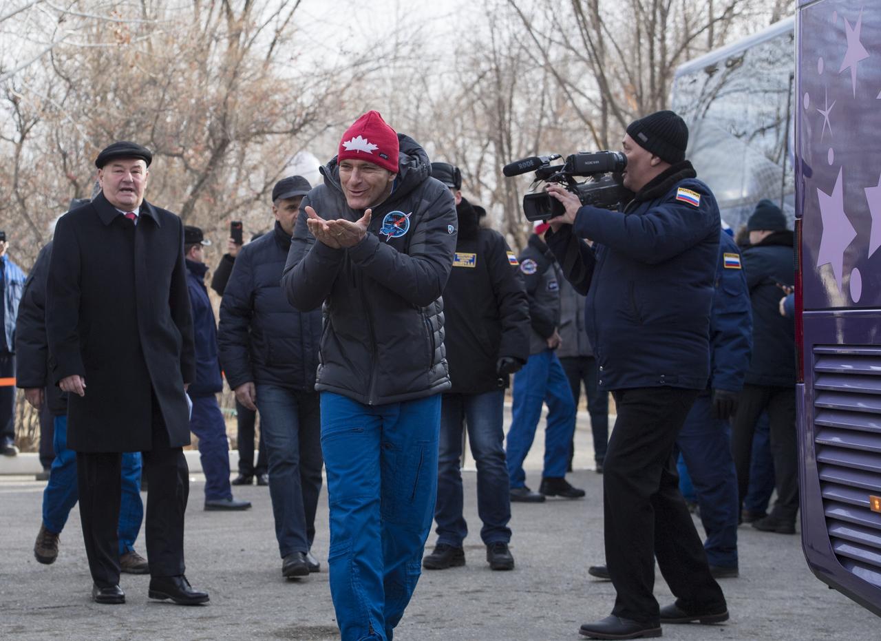 Expedition 58 Flight Engineer David Saint-Jacques of the Canadian Space Agency (CSA), blows kisses to family and friends as he departs the Cosmonaut Hotel to suit-up for his Soyuz launch to the International Space Station on Monday, Dec. 3, 2018 in Baikonur, Kazakhstan. Launch of the Soyuz rocket is Dec. 3 and will send Saint-Jacques, Soyuz Commander Oleg Kononenko of Roscosmos, and Flight Engineer Anne McClain of NASA on a six and a half month mission aboard the International Space Station. Photo Credit: (NASA/Aubrey Gemignani)