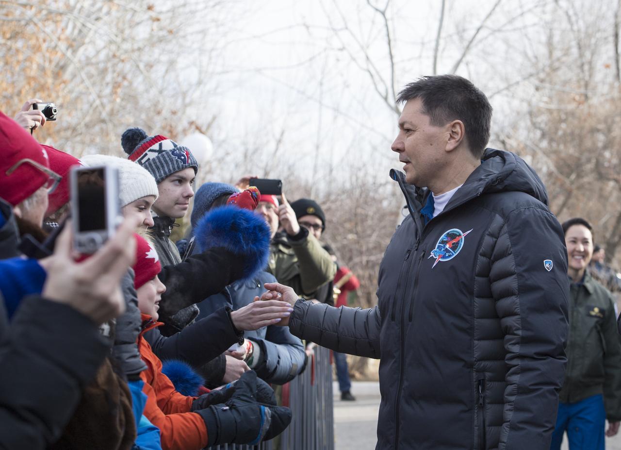 Expedition 58 Soyuz Commander Oleg Kononenko of Roscosmos greets family and friends as he departs the Cosmonaut Hotel to suit-up for his Soyuz launch to the International Space Station on Monday, Dec. 3, 2018 in Baikonur, Kazakhstan. Launch of the Soyuz rocket is Dec. 3 and will send Kononenko, Flight Engineer David Saint-Jacques of the Canadian Space Agency (CSA), and Flight Engineer Anne McClain of NASA on a six and a half month mission aboard the International Space Station. Photo Credit: (NASA/Aubrey Gemignani)