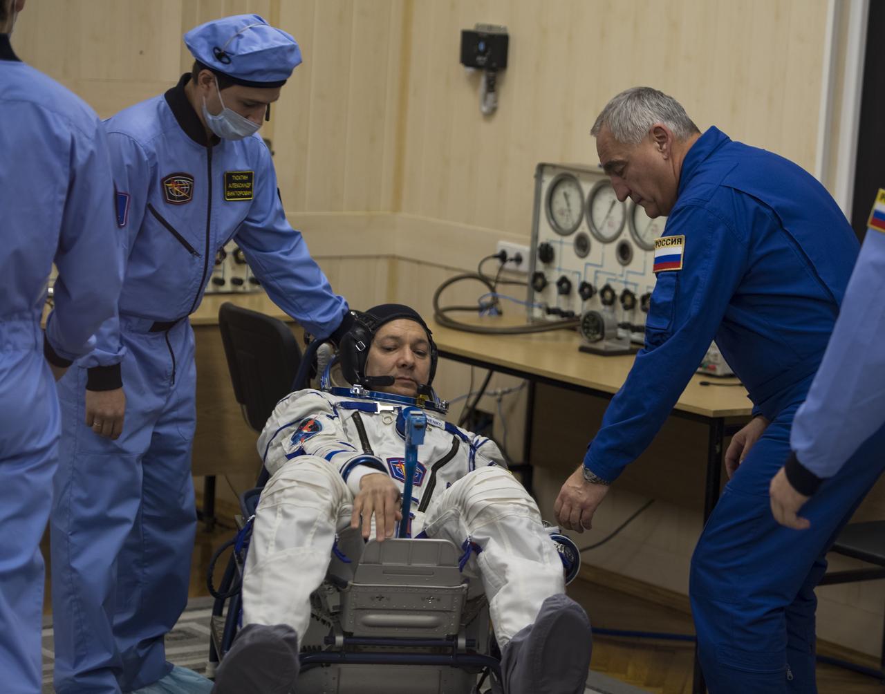 Expedition 58 Soyuz Commander Oleg Kononenko of Roscosmos has his Russian Sokol suit pressure checked in preparation for his launch aboard the Soyuz MS-11 spacecraft on Monday, Dec. 3, 2018, at the Baikonur Cosmodrome in Kazakhstan. Launch of the Soyuz rocket is scheduled for the same day and will carry Kononenko, Flight Engineer Anne McClain of NASA, and Flight Engineer David Saint-Jacques of the Canadian Space Agency (CSA) into orbit to begin their six and a half month mission on the International Space Station. Photo Credit: (NASA/Aubrey Gemignani)