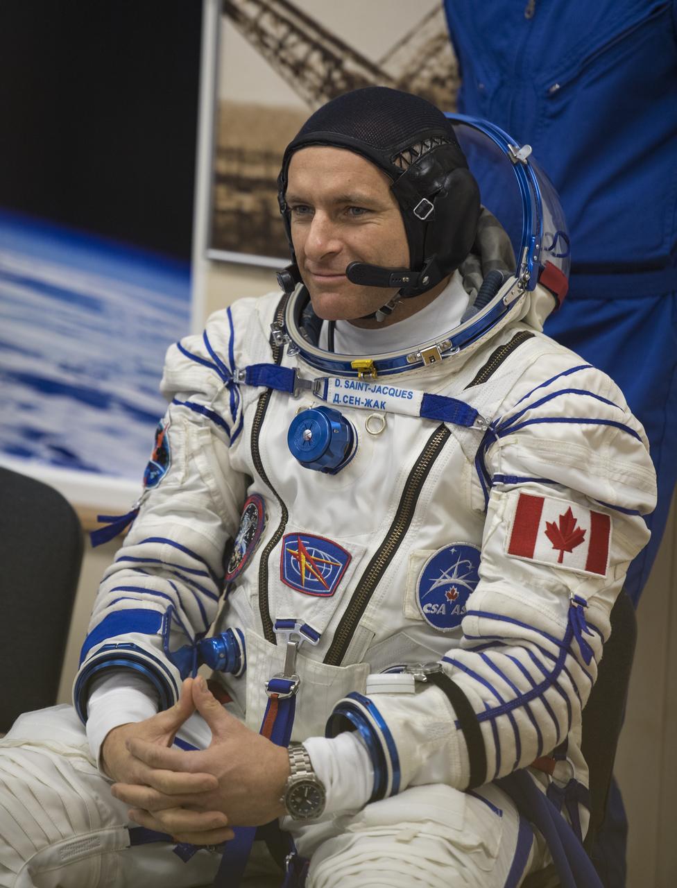 Expedition 58 Flight Engineer David Saint-Jacques of the Canadian Space Agency (CSA) waits to have his Russian Sokol suit pressure checked in preparation for his launch aboard the Soyuz MS-11 spacecraft on Monday, Dec. 3, 2018, at the Baikonur Cosmodrome in Kazakhstan. Launch of the Soyuz rocket is scheduled for the same day and will carry Saint-Jacques, Flight Engineer Anne McClain of NASA, and Soyuz Commander Oleg Kononenko of Roscosmos into orbit to begin their six and a half month mission on the International Space Station. Photo Credit: (NASA/Aubrey Gemignani)