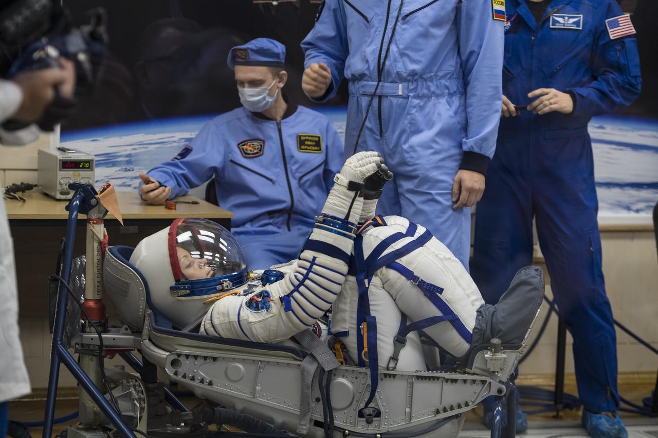 Expedition 58 Flight Engineer Anne McClain of NASA has her Russian Sokol suit pressure checked in preparation for her launch aboard the Soyuz MS-11 spacecraft on Monday, Dec. 3, 2018, at the Baikonur Cosmodrome in Kazakhstan. Launch of the Soyuz rocket is scheduled for the same day and will carry McClain, Soyuz Commander Oleg Kononenko of Roscosmos, and Flight Engineer David Saint-Jacques of the Canadian Space Agency (CSA) into orbit to begin their six and a half month mission on the International Space Station. Photo Credit: (NASA/Aubrey Gemignani)