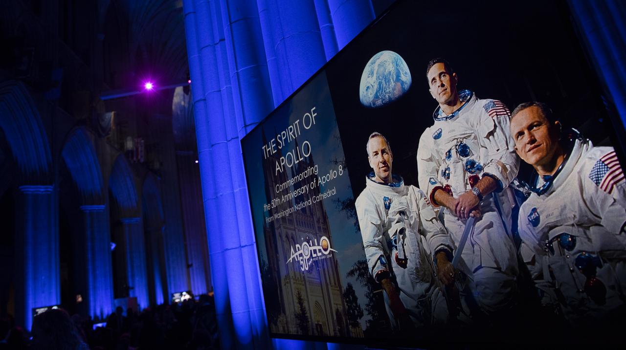 A monitor showing a portrait of the Apollo 8 crew is seen during the Smithsonian National Air and Space Museum's Spirit of Apollo event commemorating the 50th anniversary of Apollo 8, Tuesday, Dec. 11, 2018 at the Washington National Cathedral in Washington, DC. Apollo 8 was humanity's first journey to another world, taking astronauts Frank Borman, Jim Lovell, and William Anders to the Moon and back in December of 1968. Photo Credit: (NASA/Joel Kowsky)