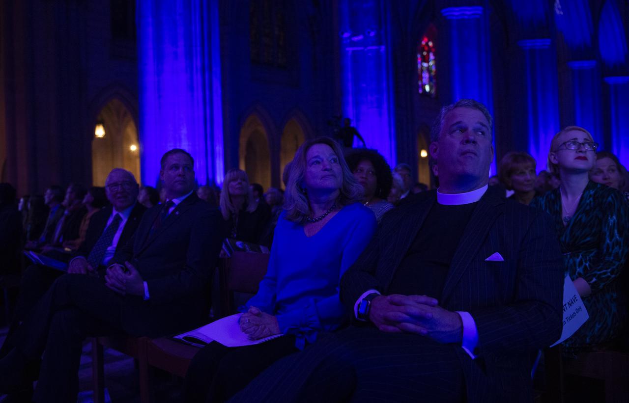 Apollo 8 astronaut Jim Lovell, left, NASA Administrator Jim Bridenstine, second from left, Ellen Stofan, Director of the Smithsonian's National Air and Space Museum, second from right, and the Very Reverend Randy Hollerith, Dean of the Washington National Cathedral, are seen as they watch a video on the Apollo 8 mission during the Smithsonian National Air and Space Museum's Spirit of Apollo event commemorating the 50th anniversary of Apollo 8, Tuesday, Dec. 11, 2018 at the Washington National Cathedral in Washington, DC. Apollo 8 was humanity's first journey to another world, taking astronauts Frank Borman, Jim Lovell, and William Anders to the Moon and back in December of 1968. Photo Credit: (NASA/Joel Kowsky)