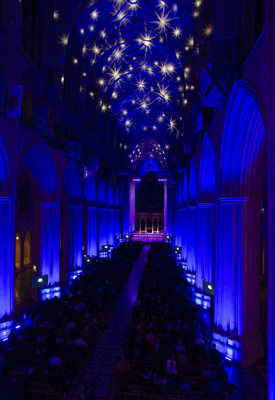 The Washington National Cathedral is seen illuminated during the Smithsonian National Air and Space Museum's Spirit of Apollo event commemorating the 50th anniversary of Apollo 8, Tuesday, Dec. 11, 2018 in Washington, DC. Apollo 8 was humanity's first journey to another world, taking astronauts Frank Borman, Jim Lovell, and William Anders to the Moon and back in December of 1968. Photo Credit: (NASA/Joel Kowsky)