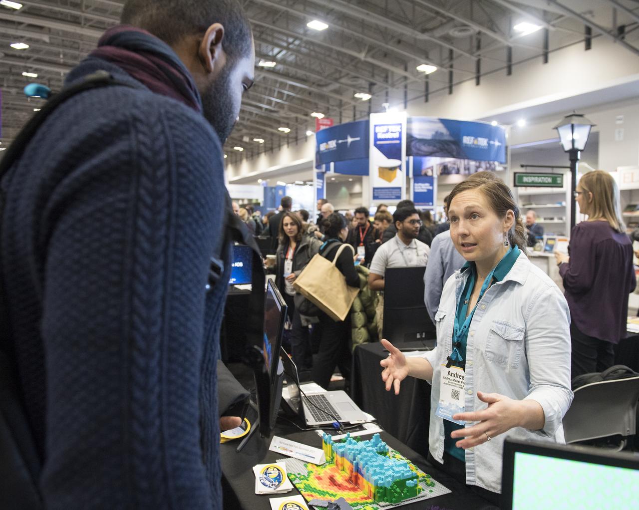 NASA booths are seen at the American Geophysical Union (AGU) annual meeting, Tuesday, Dec. 11, 2018 at the Washington Convention Center in Washington, DC. Photo Credit: (NASA/Aubrey Gemignani)