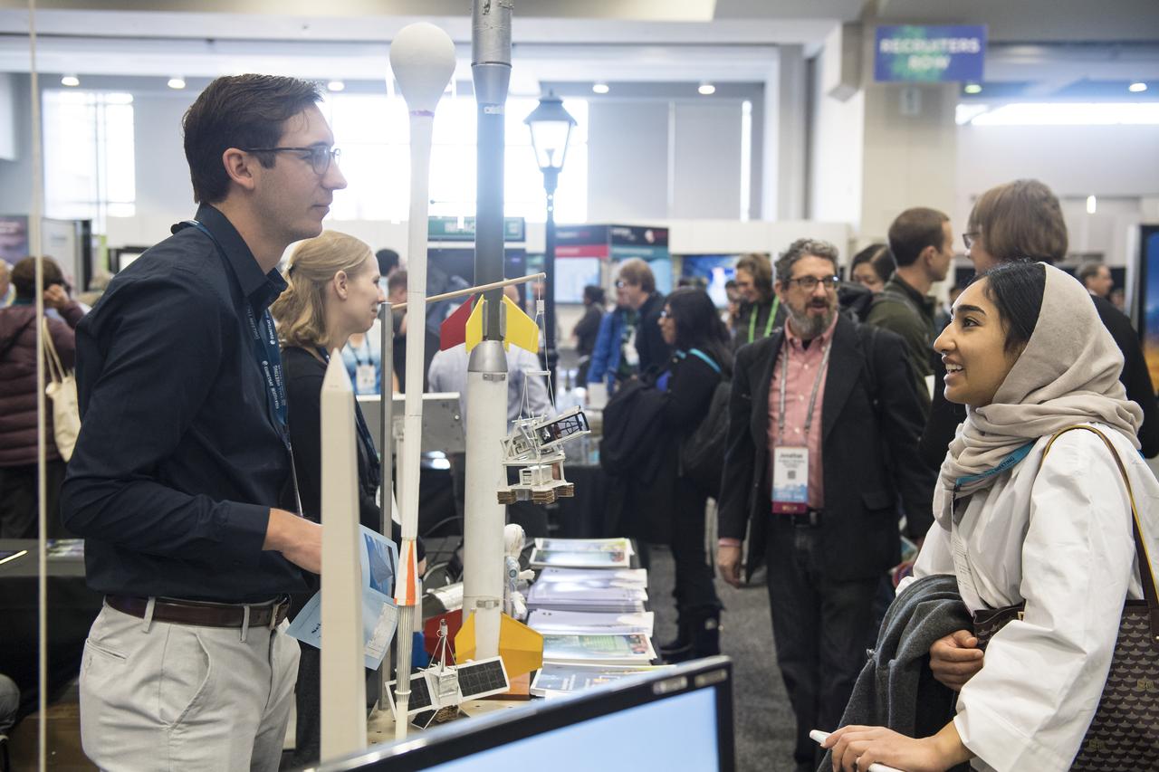 NASA booths are seen at the American Geophysical Union (AGU) annual meeting, Tuesday, Dec. 11, 2018 at the Washington Convention Center in Washington, DC. Photo Credit: (NASA/Aubrey Gemignani)