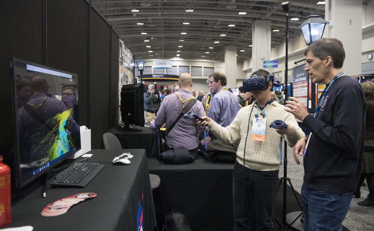 NASA booths are seen at the American Geophysical Union (AGU) annual meeting, Tuesday, Dec. 11, 2018 at the Washington Convention Center in Washington, DC. Photo Credit: (NASA/Aubrey Gemignani)