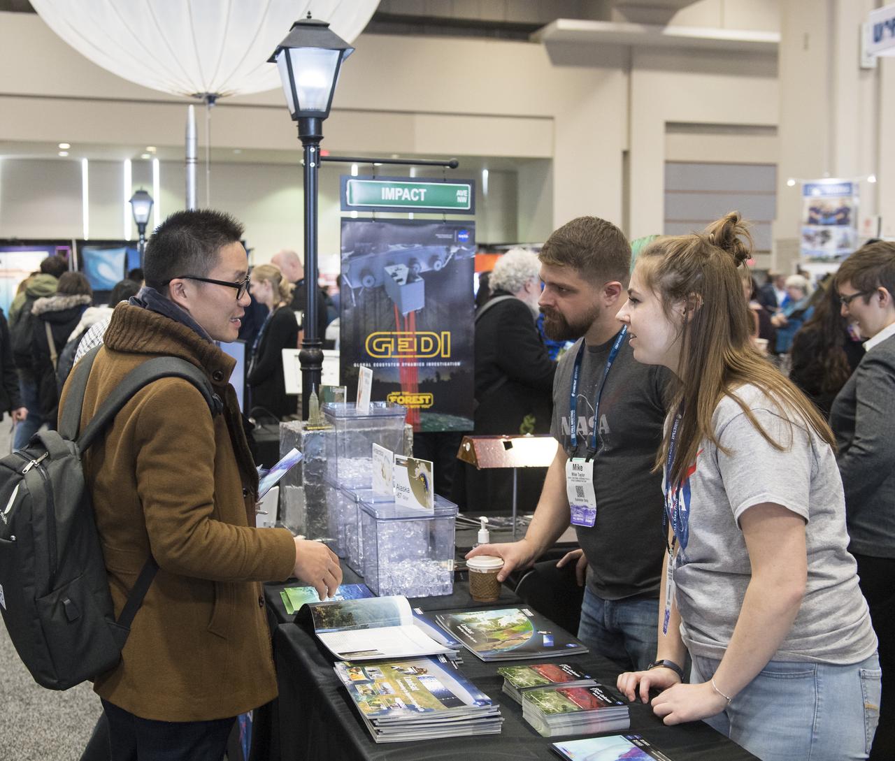 NASA booths are seen at the American Geophysical Union (AGU) annual meeting, Tuesday, Dec. 11, 2018 at the Washington Convention Center in Washington, DC. Photo Credit: (NASA/Aubrey Gemignani)