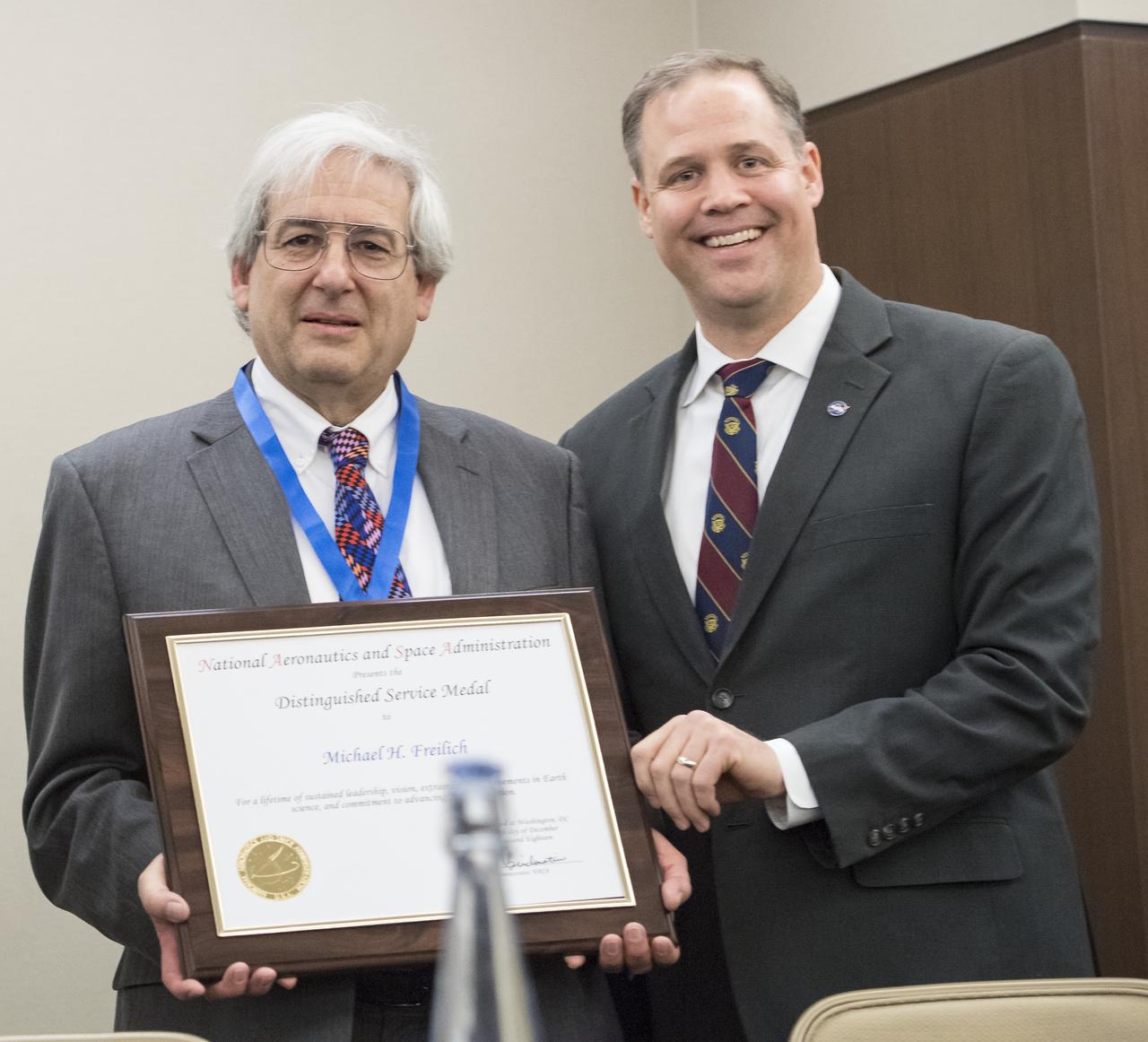 NASA Administrator Jim Bridenstine, right, and Dr. Michael Freilich, Earth Science Director, Science Mission Directorate, NASA, pose for a photo after Dr. Freilich was awarded the NASA Distinguished Service Medal at the Earth Science Town Hall at the American Geophysical Union (AGU) annual meeting, Tuesday, December 11, 2018 at the Marriott Marquis in Washington. Photo Credit: (NASA/Aubrey Gemignani)