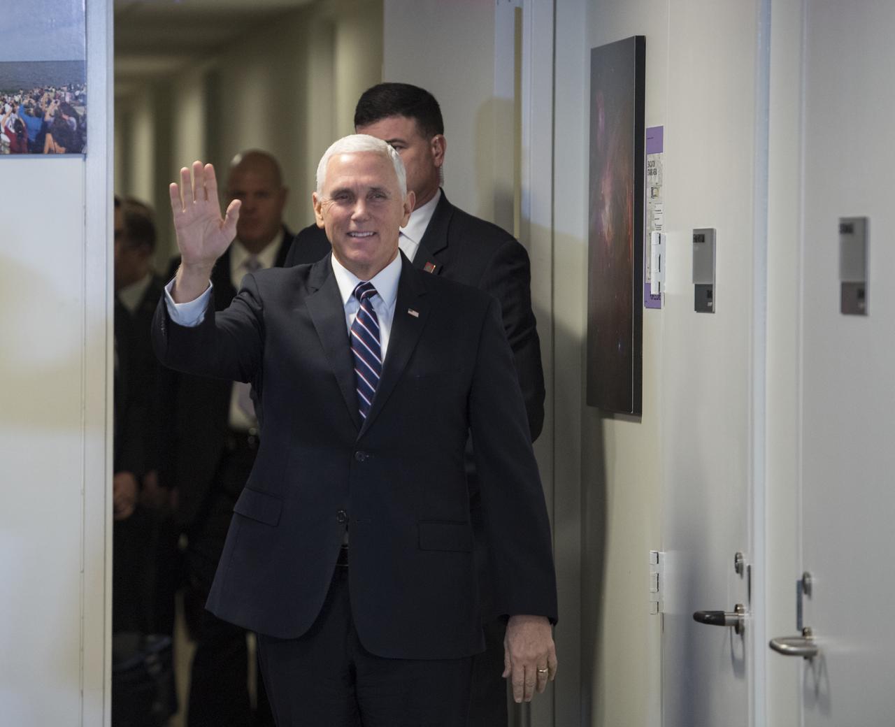 Vice President Mike Pence waves as he arrives to meet with NASA employees, after a discussion with NASA leadership about the progress on Space Policy Directive 1 (SPD-1), Wednesday, Dec. 12, 2018 at NASA Headquarters in Washington. Photo Credit: (NASA/Aubrey Gemignani)