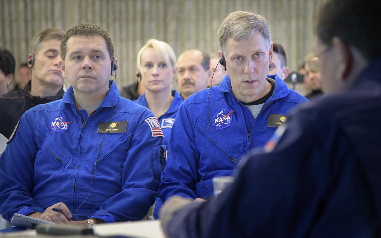 NASA Director for Human Space Flight Programs, Russia, Chad Rowe, left, NASA astronaut and Astronaut Office Representative Kate Rubins, center, and NASA International Space Station Operations Integration Manager Kenny Todd listen as NASA, ESA, Roscosmos, and Russian Search and Recovery Forces meet at the Cosmonaut Hotel in Karaganda, Kazakhstan to discuss the readiness for the landing of Expedition 57 crew members Serena Auñón-Chancellor of NASA, Alexander Gerst of ESA (European Space Agency), and Sergey Prokopyev of Roscosmos, Tuesday, Dec. 18, 2018. Auñón-Chancellor, Gerst, and Prokopyev are returning after 197 days in space where they served as members of the Expedition 56 and 57 crews onboard the International Space Station. Photo Credit: (NASA/Bill Ingalls)