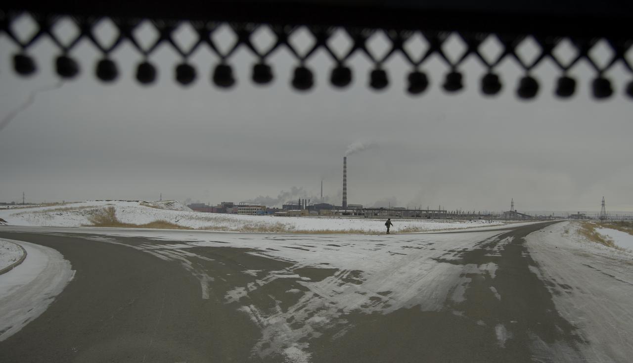 The town of Zhezkazgan, Kazakhstan is seen from the bus carrying team members from NASA, ESA, Roscosmos, and Russian Search and Recovery Forces as they arrive in advance of the landing of Expedition 57 crew members Serena Auñón-Chancellor of NASA, Alexander Gerst of ESA (European Space Agency), and Sergey Prokopyev of Roscosmos. Wednesday, Dec. 19, 2018. Auñón-Chancellor, Gerst, and Prokopyev are returning after 197 days in space where they served as members of the Expedition 56 and 57 crews onboard the International Space Station. Photo Credit: (NASA/Bill Ingalls)