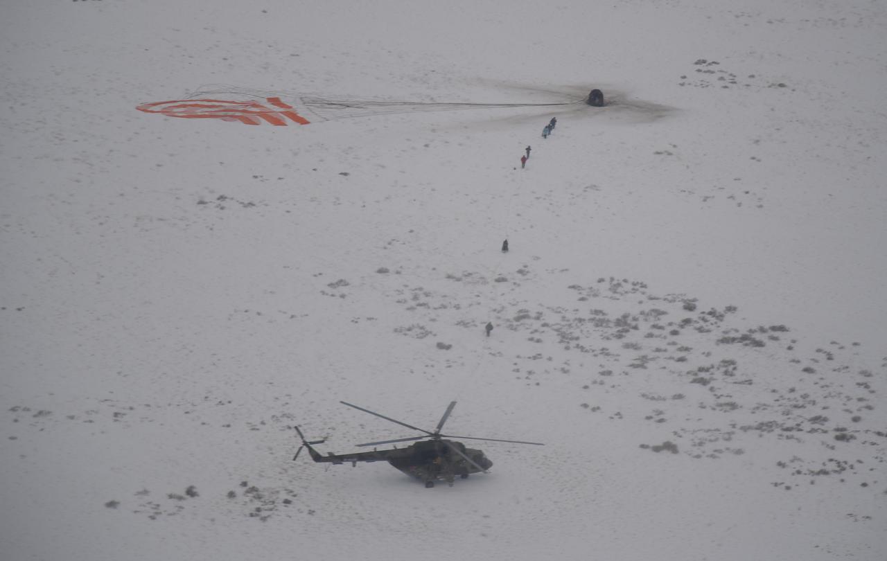 Russian Search and Rescue teams arrive at the Soyuz MS-09 spacecraft shortly after it landed with Expedition 57 crew members Serena Auñón-Chancellor of NASA, Alexander Gerst of ESA (European Space Agency), and Sergey Prokopyev of Roscosmos near the town of Zhezkazgan, Kazakhstan on Thursday, Dec. 20, 2018. Auñón-Chancellor, Gerst, and Prokopyev are returning after 197 days in space where they served as members of the Expedition 56 and 57 crews onboard the International Space Station. Photo Credit: (NASA/Bill Ingalls)