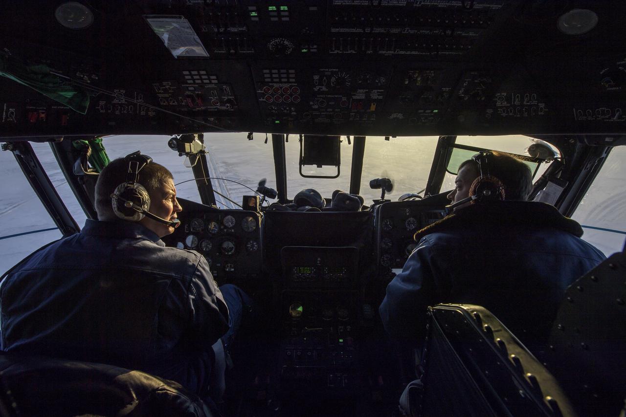 Russian Search and Recovery Force pilots scan the horizon for the Soyuz landing with Expedition 57 crew members Serena Auñón-Chancellor of NASA, Alexander Gerst of ESA (European Space Agency), and Sergey Prokopyev of Roscosmos. Thursday, Dec. 20, 2018. Auñón-Chancellor, Gerst, and Prokopyev are returning after 197 days in space where they served as members of the Expedition 56 and 57 crews onboard the International Space Station. Photo Credit: (NASA/Bill Ingalls)