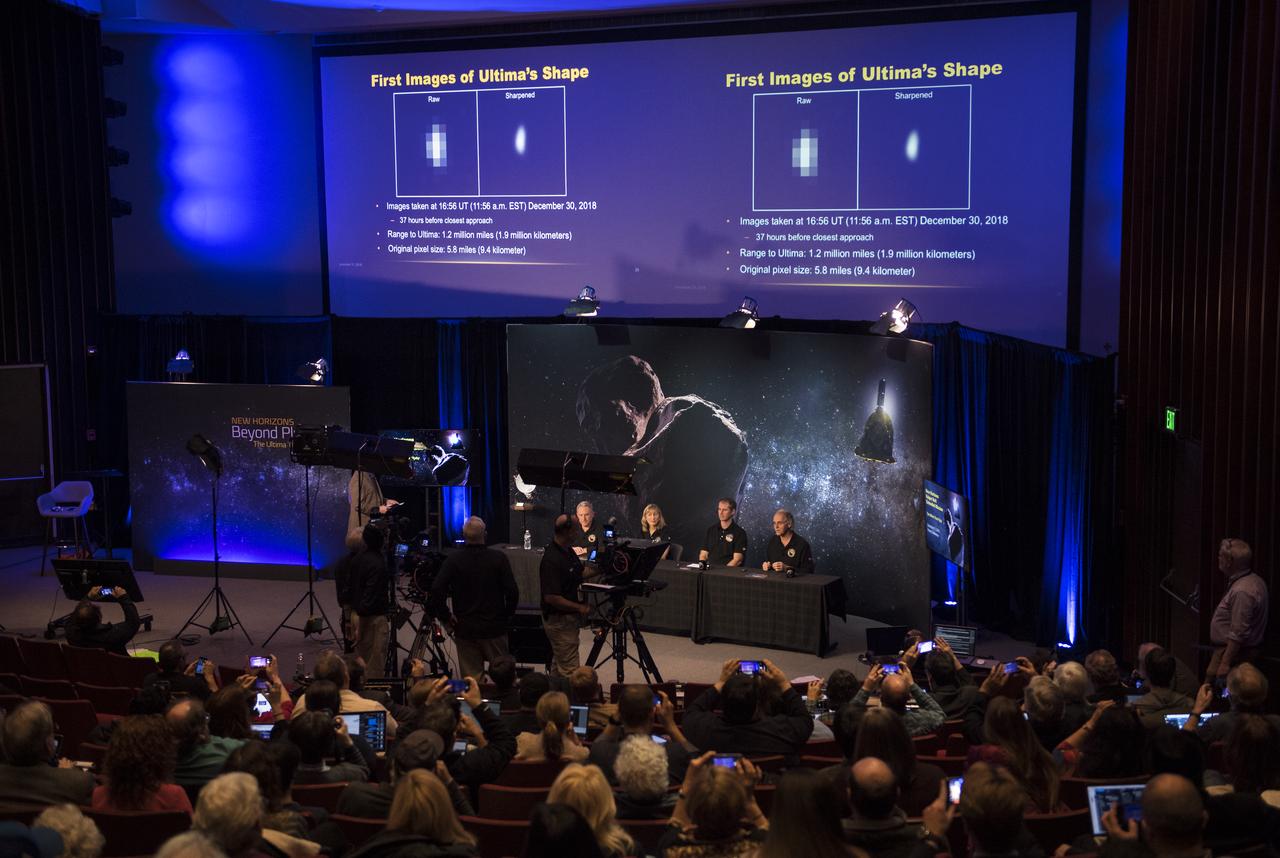 New Horizons co-investigator John Spencer of the Southwest Research Institute (SwRI), Boulder, CO, right, speaks during a press conference prior to the flyby about the first images received from the New Horizons spacecraft of Ultima Thule that were captured on Dec. 30 as the spacecraft was 1.2 million miles away from Ultima Thule, Monday, Dec. 31, 2018 at Johns Hopkins University Applied Physics Laboratory (APL) in Laurel, Maryland. Photo Credit: (NASA/Joel Kowsky)