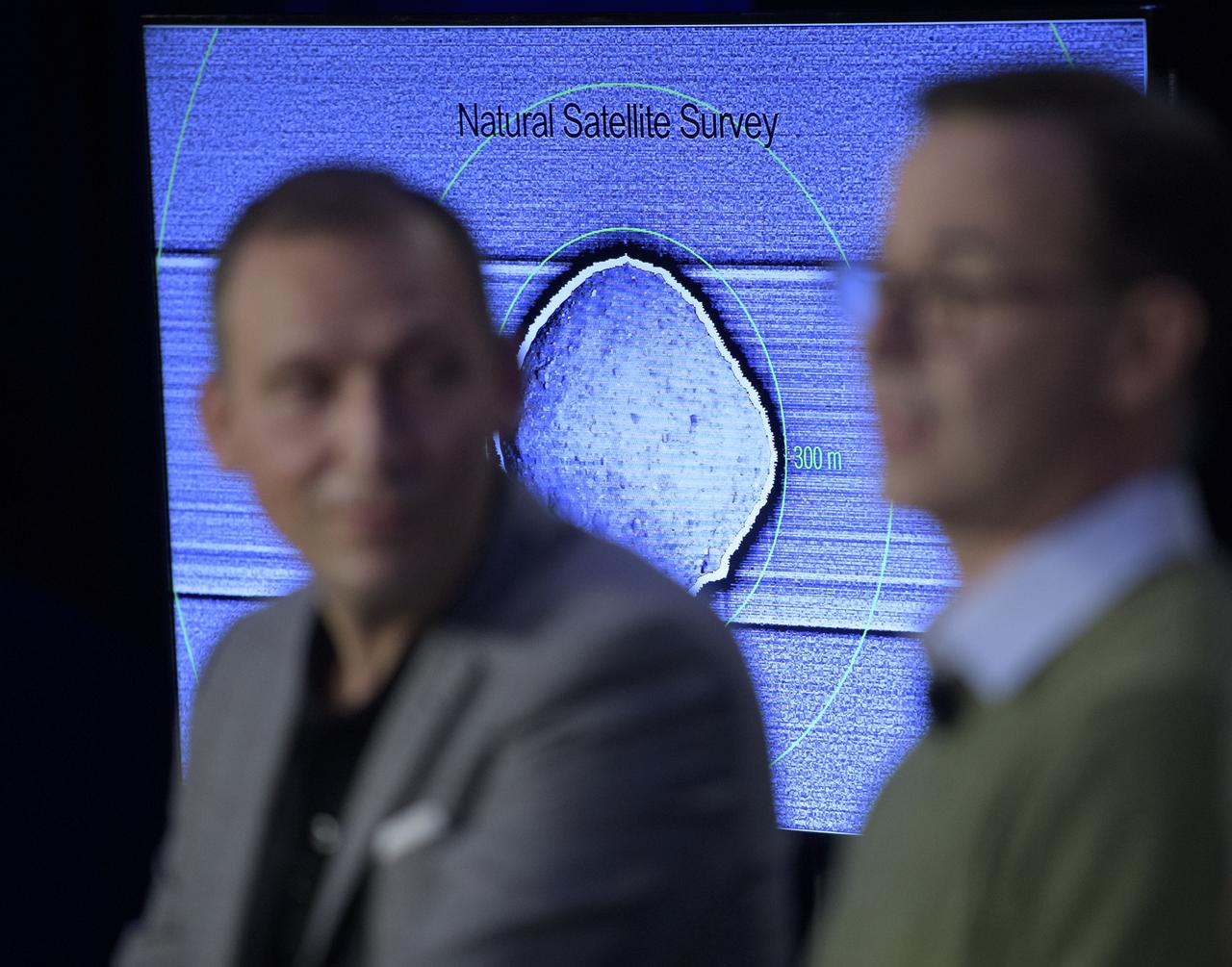 An image of asteroid Bennu is shown as Olivier Barnouin (US Instrument Scientist, Johns Hopkins University/APL) discusses the OSIRIS-REx mission, Monday, Dec. 31, 2018 at Johns Hopkins University Applied Physics Laboratory (APL) in Laurel, Maryland. Photo Credit: (NASA/Bill Ingalls)