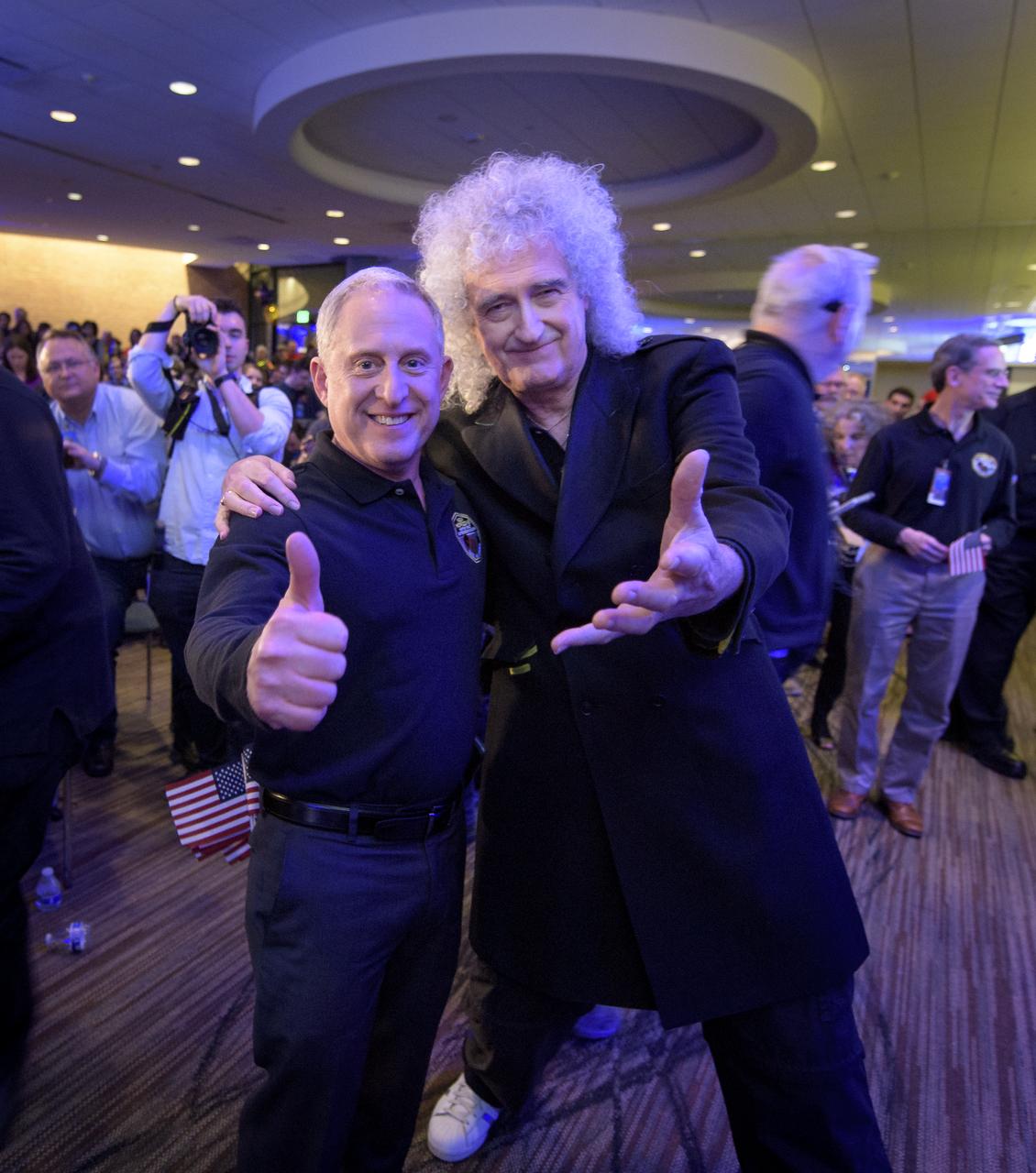New Horizons principal investigator Alan Stern of the Southwest Research Institute (SwRI), Boulder, CO, left, and Brian May, lead guitarist of the rock band Queen and astrophysicist, pose for a photograph after a New Years event, Tuesday, Jan. 1, 2019 at Johns Hopkins University Applied Physics Laboratory (APL) in Laurel, Maryland. Photo Credit: (NASA/Bill Ingalls)