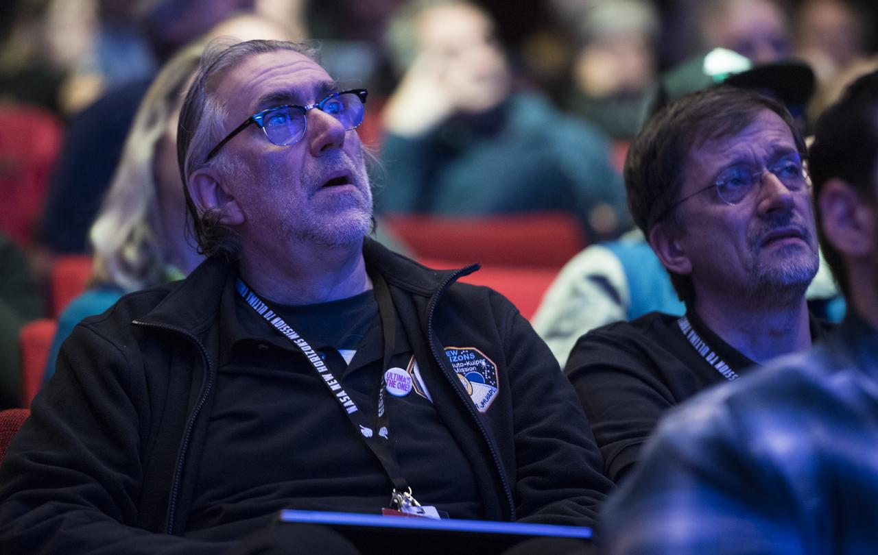 New Horizons team members and guests watch a live feed of the Mission Operations Center (MOC) as the team waits to receive confirmation from the spacecraft that it has completed the flyby of Ultima Thule, Tuesday, Jan. 1, 2019 at Johns Hopkins University Applied Physics Laboratory (APL) in Laurel, Maryland. Photo Credit: (NASA/Joel Kowsky)