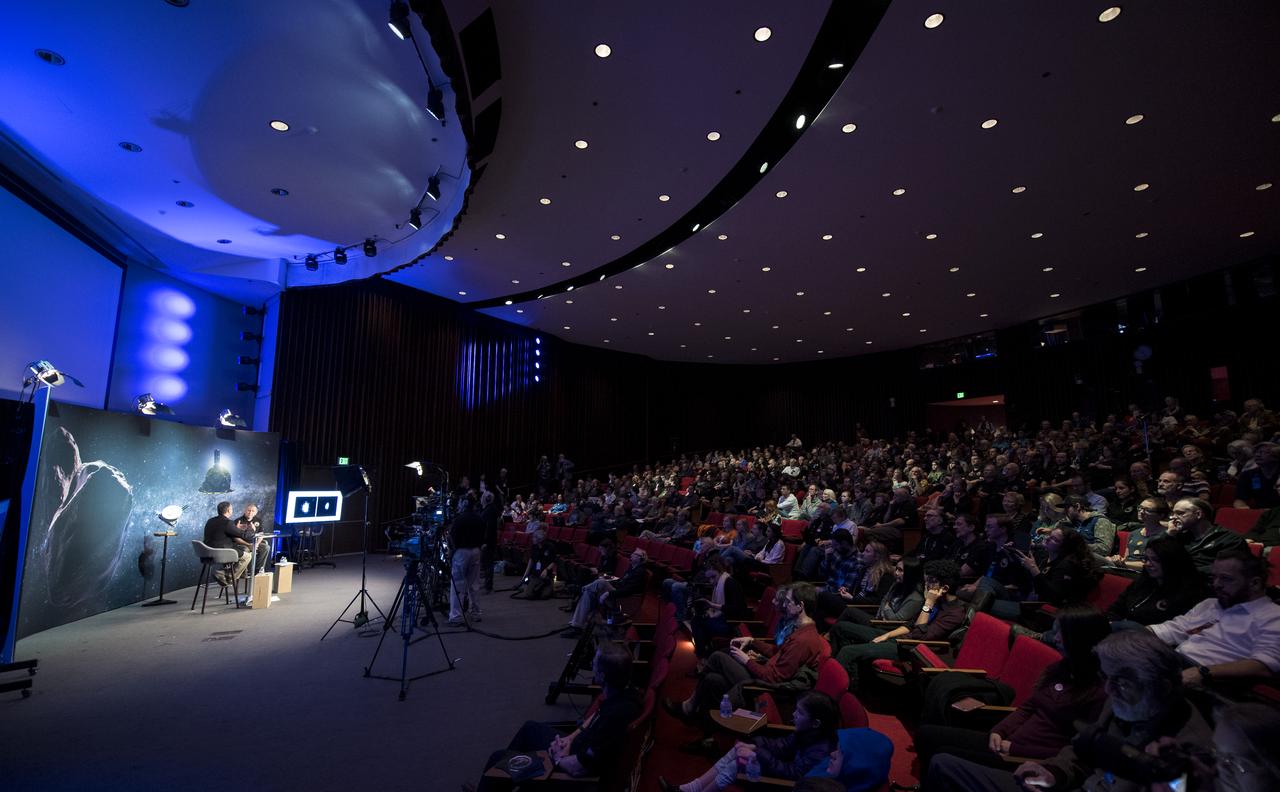New Horizons team members and guests watch a live feed of the Mission Operations Center (MOC) as the team waits to receive confirmation from the spacecraft that it has completed the flyby of Ultima Thule, Tuesday, Jan. 1, 2019 at Johns Hopkins University Applied Physics Laboratory (APL) in Laurel, Maryland. Photo Credit: (NASA/Joel Kowsky)