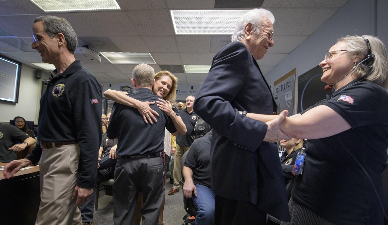 New Horizons mission managers rejoice after they received signals from the spacecraft that it is healthy and collected data during the flyby of Ultima Thule, Tuesday, Jan. 1, 2019 at the Mission Operations Center of the Johns Hopkins University Applied Physics Laboratory (APL) in Laurel, Maryland. Pictured from left; Director of the Johns Hopkins University Applied Physics Laboratory Ralph Semmel: New Horizons principal investigator Alan Stern of the Southwest Research Institute (SwRI), Boulder, CO: Acting director of Planetary Science at NASA Headquarters Lori Glaze: APL Space Department Head Emeritus Stamatios (Tom) Krimigis, and New Horizons Mission Operations Manager Alice Bowman. Photo Credit: (NASA/Bill Ingalls)