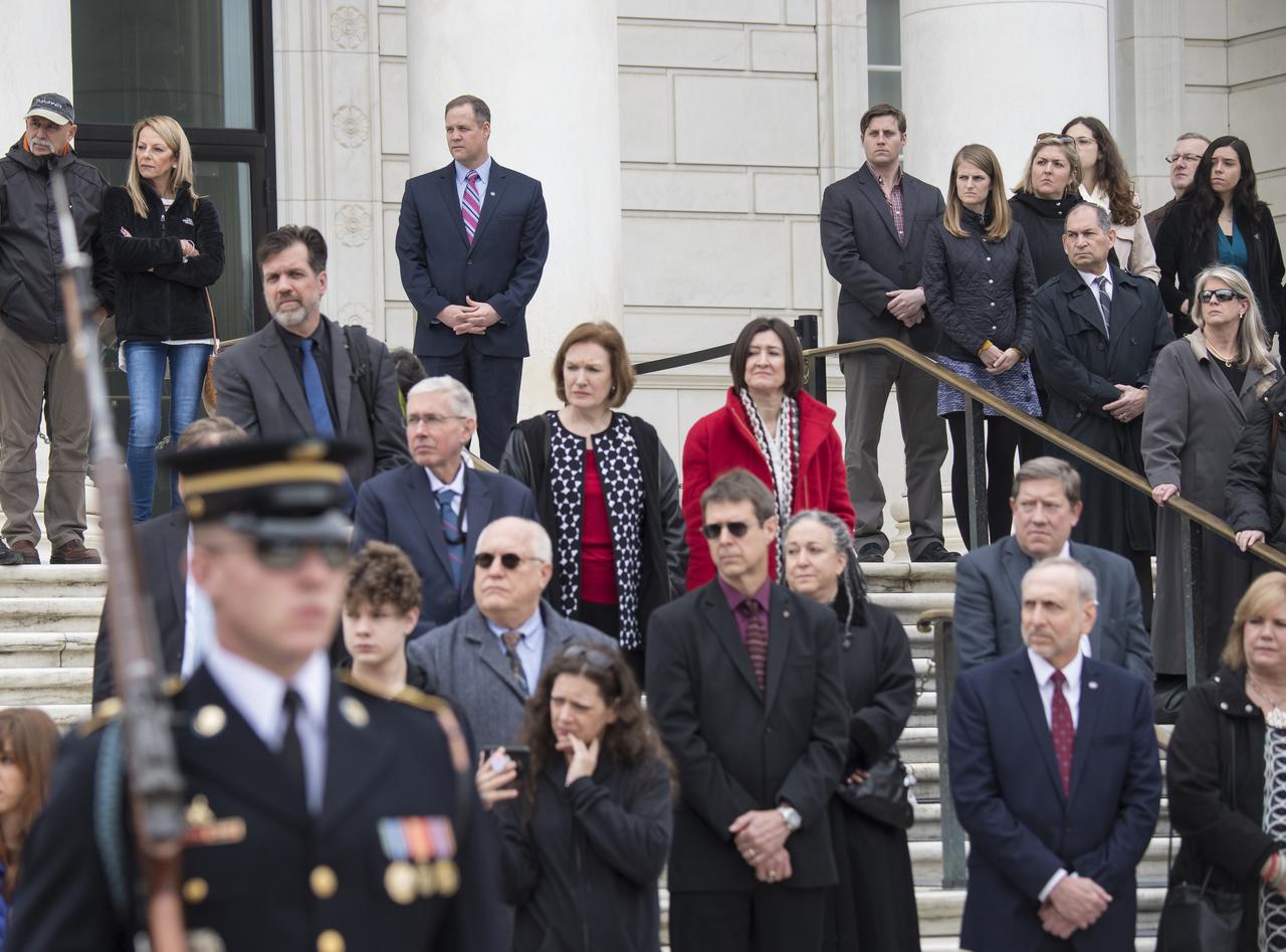 NASA personnel watch the Changing of the Guard ritual before a wreath is laid at the Tomb of the Unknowns by NASA Administrator Jim Bridenstine as part of NASA's Day of Remembrance, Thursday, Feb. 7, 2019, at Arlington National Cemetery in Arlington, Va.  The wreaths were laid in memory of those men and women who lost their lives in the quest for space exploration.  Photo Credit: (NASA/Aubrey Gemignani)