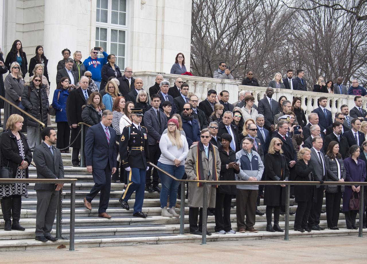 NASA personnel watch as NASA Administrator Jim Bridenstine prepares to lay a wreath at the Tomb of the Unknowns as part of NASA's Day of Remembrance, Thursday, Feb. 7, 2019, at Arlington National Cemetery in Arlington, Va.  The wreaths were laid in memory of those men and women who lost their lives in the quest for space exploration.  Photo Credit: (NASA/Aubrey Gemignani)