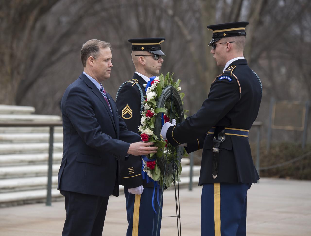 NASA Administrator Jim Bridenstine, left, lays a wreath at the Tomb of the Unknowns as part of NASA's Day of Remembrance, Thursday, February 7, 2019, at Arlington National Cemetery in Arlington, Va. The wreaths were laid in memory of those men and women who lost their lives in the quest for space exploration. Photo Credit: (NASA/Aubrey Gemignani)