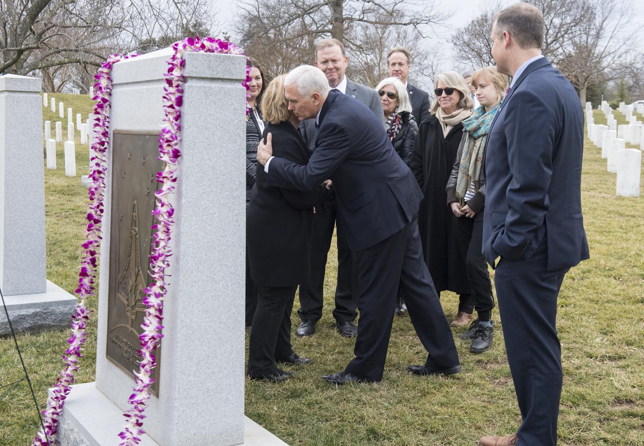 Vice President Mike Pence hugs June Scobee-Rodgers, widow of Challenger Commander Dick Scobee at the Space Shuttle Columbia Memorial after a wreath laying ceremony that was part of NASA's Day of Remembrance, Thursday, Feb. 7, 2019, at Arlington National Cemetery in Arlington, Va. Wreaths were laid in memory of those men and women who lost their lives in the quest for space exploration.  Photo Credit: (NASA/Aubrey Gemignani)