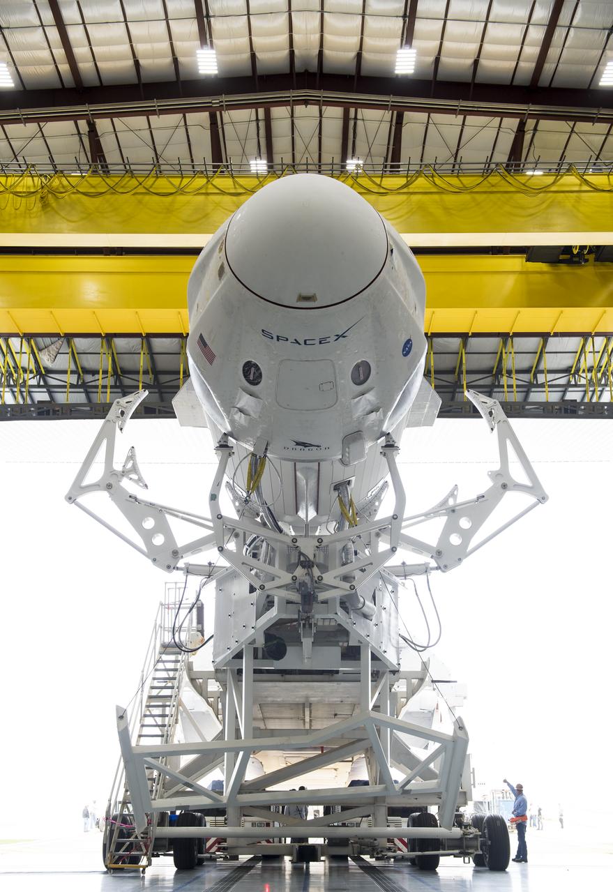 A SpaceX Falcon 9 rocket with the company's Crew Dragon spacecraft onboard is seen as it is rolled out of the horizontal integration facility at Launch Complex 39A as preparations continue for the Demo-1 mission, Feb. 28, 2019 at the Kennedy Space Center in Florida. The Demo-1 mission will be the first launch of a commercially built and operated American spacecraft and space system designed for humans as part of NASA's Commercial Crew Program. The mission, currently targeted for a 2:49am launch on March 2, will serve as an end-to-end test of the system's capabilities. Photo Credit: (NASA/Joel Kowsky)