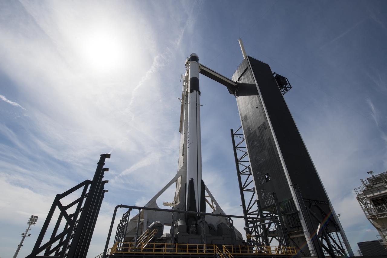 The SpaceX Falcon 9 rocket with the company's Crew Dragon spacecraft onboard is seen on the launch pad at Launch Complex 39A as preparations continue for the Demo-1 mission, Friday, March 1, 2019 at the Kennedy Space Center in Florida. The Demo-1 mission will be the first launch of a commercially built and operated American spacecraft and space system designed for humans as part of NASA's Commercial Crew Program. The mission, currently targeted for a 2:49am launch on March 2, will serve as an end-to-end test of the system's capabilities. Photo Credit: (NASA/Joel Kowsky)