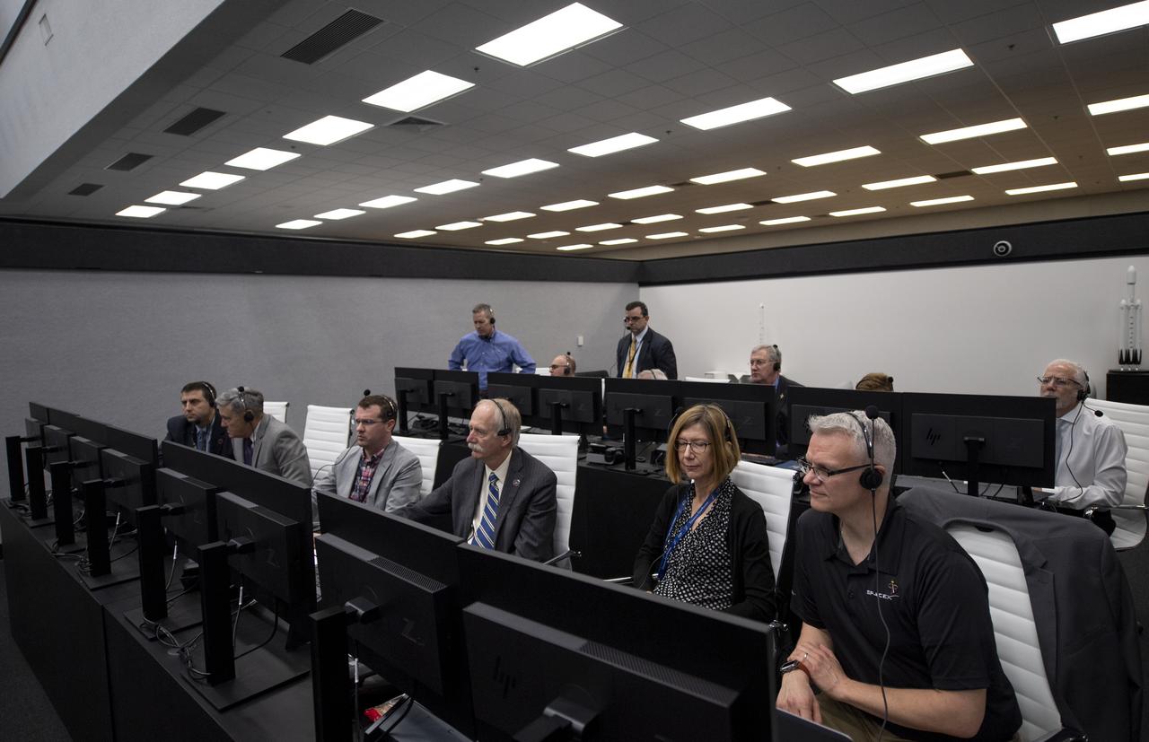 NASA management monitors the countdown of the launch of a SpaceX Falcon 9 rocket carrying the company's Crew Dragon spacecraft on the Demo-1 mission from firing room four of the Launch Control Center, Saturday, March 2, 2019 at the Kennedy Space Center in Florida. The Demo-1 mission is the first launch of a commercially built and operated American spacecraft and space system designed for humans as part of NASA's Commercial Crew Program. The mission will serve as an end-to-end test of the system's capabilities. Photo Credit: (NASA/Joel Kowsky)
