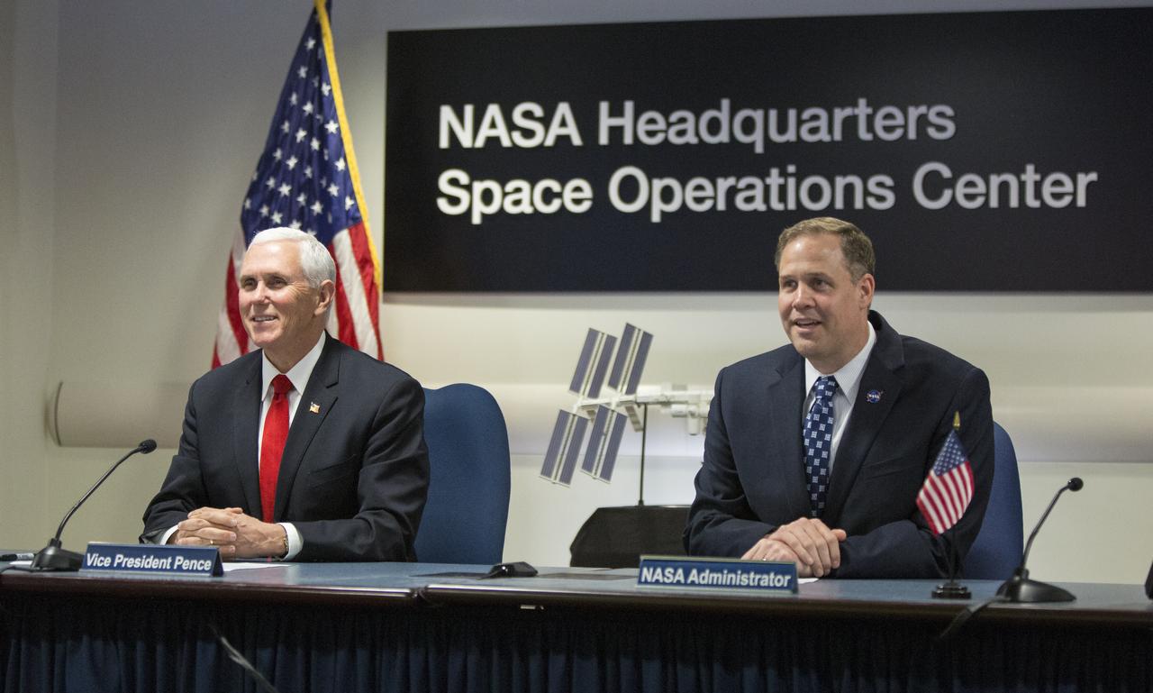 Vice President Mike Pence, left, and NASA Administrator Jim Bridenstine, right, speak with Expedition 58 flight engineer Anne McClain of NASA, and flight engineer David Saint-Jacques of the Canadian Space Agency (CSA) who are onboard the International Space Station, Wednesday, March 6, 2019 from the Space Operations Center at NASA Headquarters in Washington. Vice President Pence and Administrator Bridenstine spoke with the astronauts about the arrival of SpaceX's Crew Dragon spacecraft at the International Space Station. Photo Credit: (NASA/Joel Kowsky)
