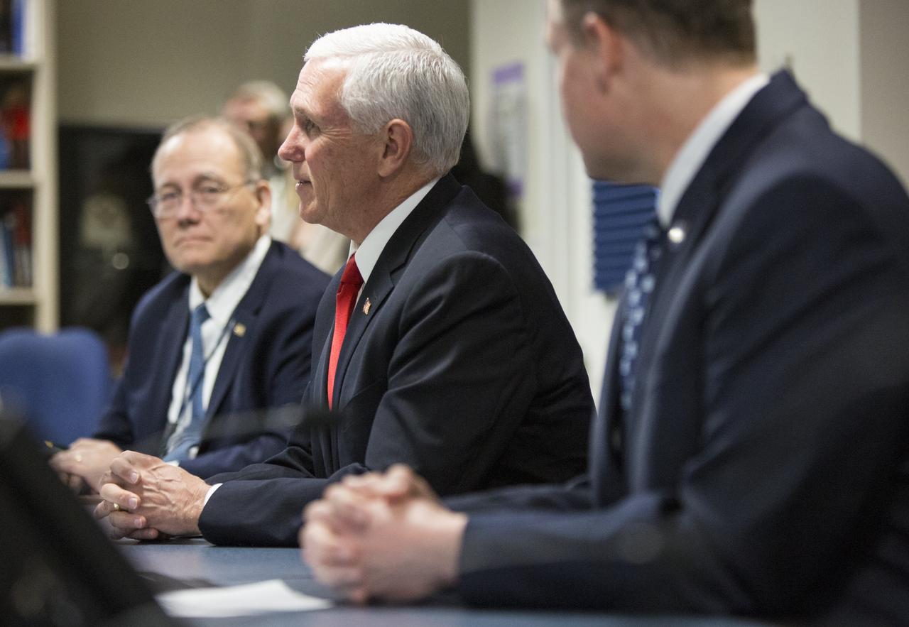 Vice President Mike Pence, center, speaks with Expedition 58 flight engineer Anne McClain of NASA, and flight engineer David Saint-Jacques of the Canadian Space Agency (CSA) who are onboard the International Space Station, Wednesday, March 6, 2019 from the Space Operations Center at NASA Headquarters in Washington. Vice President Pence and Administrator Bridenstine spoke with the astronauts about the arrival of SpaceX's Crew Dragon spacecraft at the International Space Station. Photo Credit: (NASA/Joel Kowsky)