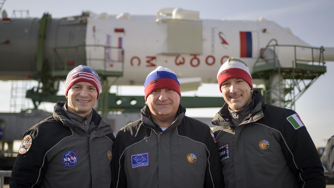 Expedition 59 backup crewmembers Drew Morgan of NASA, left, Alexander Skvortsov of Roscosmos, center, and Luca Parmitano of the European Space Agency pose for a photograph as the Soyuz rocket arrives at the launch pad, Tuesday, March 12, 2019 at the Baikonur Cosmodrome in Kazakhstan. Expedition 59 crewmembers Nick Hague and Christina Koch of NASA, along with Alexey Ovchinin of Roscosmos, will launch March 14, U.S. time, on the Soyuz MS-12 spacecraft from the Baikonur Cosmodrome for a six-and-a-half month mission on the International Space Station. Photo Credit: (NASA/Bill Ingalls)