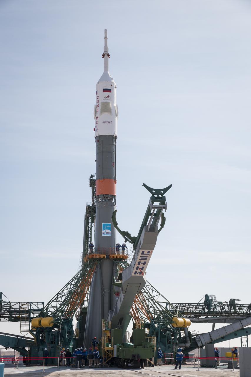The Soyuz rocket is raised into vertical position on the launch pad, Tuesday, March 12, 2019 at the Baikonur Cosmodrome in Kazakhstan. Expedition 59 crewmembers Nick Hague and Christina Koch of NASA, along with Alexey Ovchinin of Roscosmos, will launch March 14, U.S. time, on the Soyuz MS-12 spacecraft from the Baikonur Cosmodrome for a six-and-a-half month mission on the International Space Station. Photo Credit: (NASA/Victor Zelentsov)