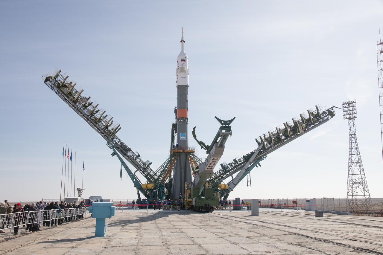 The Soyuz rocket is raised into vertical position on the launch pad, Tuesday, March 12, 2019 at the Baikonur Cosmodrome in Kazakhstan. Expedition 59 crewmembers Nick Hague and Christina Koch of NASA, along with Alexey Ovchinin of Roscosmos, will launch March 14, U.S. time, on the Soyuz MS-12 spacecraft from the Baikonur Cosmodrome for a six-and-a-half month mission on the International Space Station. Photo Credit: (NASA/Victor Zelentsov)