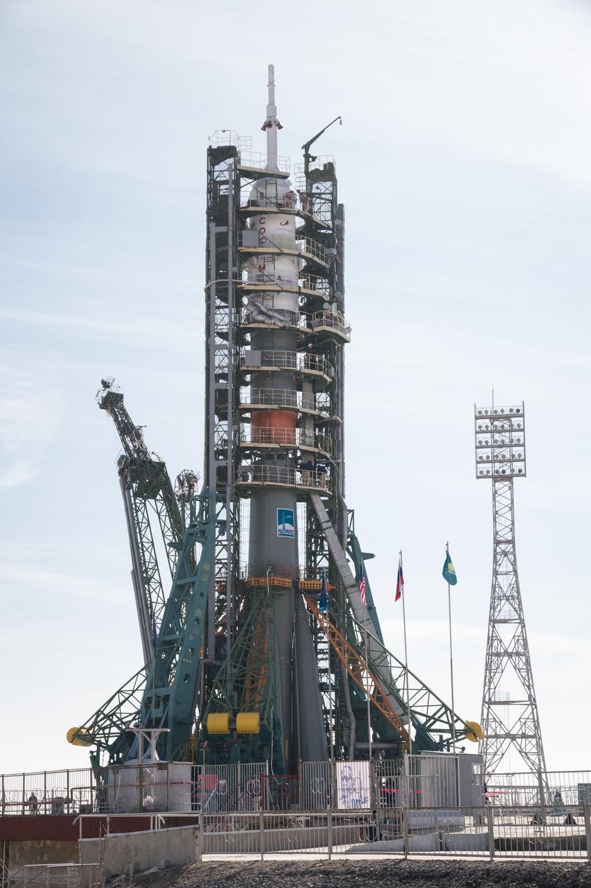The Soyuz rocket is raised into vertical position on the launch pad, Tuesday, March 12, 2019 at the Baikonur Cosmodrome in Kazakhstan. Expedition 59 crewmembers Nick Hague and Christina Koch of NASA, along with Alexey Ovchinin of Roscosmos, will launch March 14, U.S. time, on the Soyuz MS-12 spacecraft from the Baikonur Cosmodrome for a six-and-a-half month mission on the International Space Station. Photo Credit: (NASA/Victor Zelentsov)