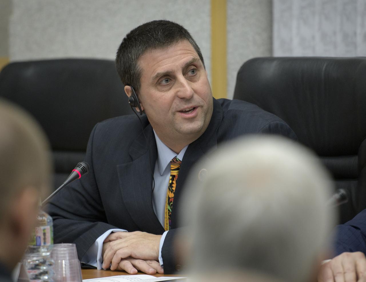 NASA ISS Deputy Program Manager Joel Montalbano delivers remarks during the State Commission meeting to approve the Expedition 59 crew's Soyuz launch to the International Space Station, Wednesday, March 13, 2019 at the Cosmonaut Hotel in Baikonur, Kazakhstan. Hague, Koch, and Ovchinin will launch March 14, U.S. time, on the Soyuz MS-12 spacecraft from the Baikonur Cosmodrome for a six-and-a-half month mission on the International Space Station. Photo Credit: (NASA/Bill Ingalls)