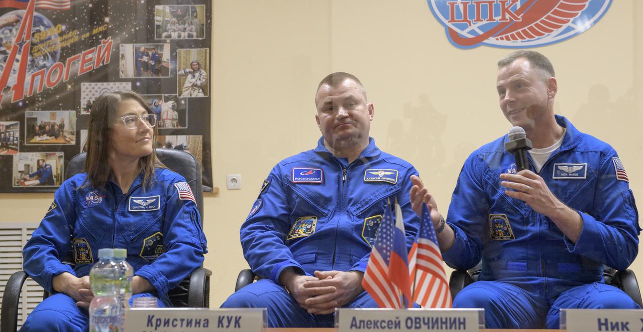 Expedition 59 prime crew members Christina Koch of NASA, left, Alexey Ovchinin of Roscsmos, and Nick Hague of NASA, right, answer questions during a press conference, Wednesday, March 13, 2019 at the Cosmonaut Hotel in Baikonur, Kazakhstan. Hague, Koch, and Ovchinin will launch March 14, U.S. time, on the Soyuz MS-12 spacecraft from the Baikonur Cosmodrome for a six-and-a-half month mission on the International Space Station. Photo Credit: (NASA/Bill Ingalls)