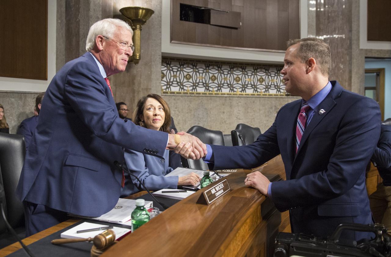 NASA Administrator Jim Bridenstine, right, is seen with Senator Roger Wicker, R-Miss., Chairman of the Senate Committee on Commerce, Science, and Transportation and Senator Maria Cantwell, D-Wash., Ranking Member of the committee prior to a committee hearing titled "The New Space Race: Ensuring U.S. Global Leadership on the Final Frontier," Wednesday, March 13, 2019 at the Dirksen Senate Office Building in Washington. Photo Credit: (NASA/Joel Kowsky)
