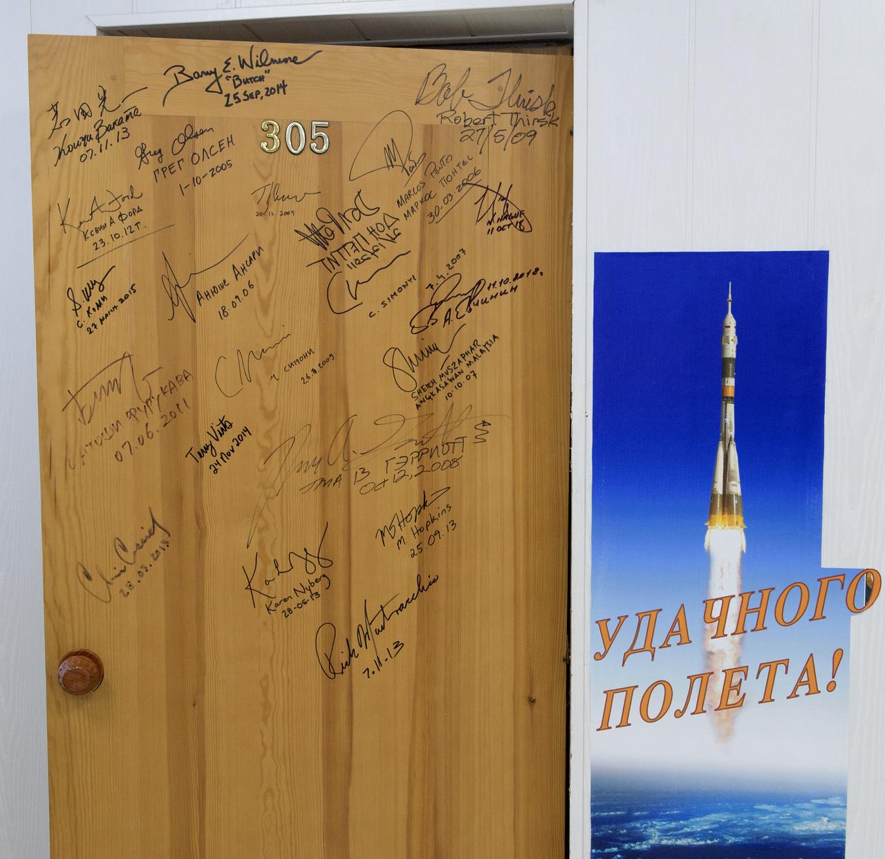A door in the Cosmonaut Hotel that Expedition 59 crewmembers Nick Hague and Christina Koch of NASA, along with Alexey Ovchinin of Roscosmos will sign prior to departing for launch on a Soyuz rocket, Thursday, March 14, 2019 in Baikonur, Kazakhstan. Hague, Koch, and Ovchinin will launch March 14, U.S. time, on the Soyuz MS-12 spacecraft from the Baikonur Cosmodrome for a six-and-a-half month mission on the International Space Station. Photo Credit: (NASA/Bill Ingalls)