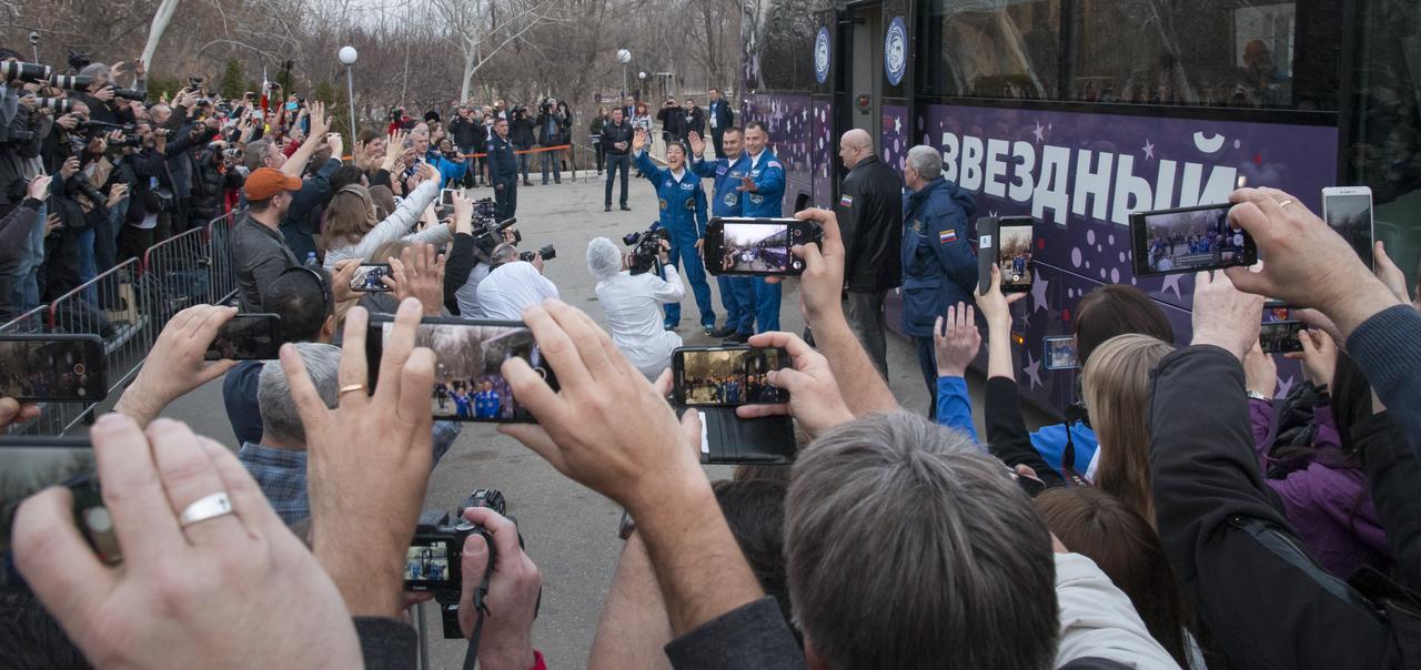 Expedition 59 astronaut Christina Koch of NASA, left, Alexey Ovchinin of Roscosmos, center, and Nick Hague of NASA are seen as they depart the Cosmonaut Hotel ahead of their Soyuz launch to the International Space Station, Thursday, March 14, 2019 in Baikonur, Kazakhstan. Hague, Koch, and Ovchinin launched March 14, U.S. time, on the Soyuz MS-12 spacecraft from the Baikonur Cosmodrome for a six-and-a-half month mission on the International Space Station. Photo Credit: (NASA/Victor Zelentsov)