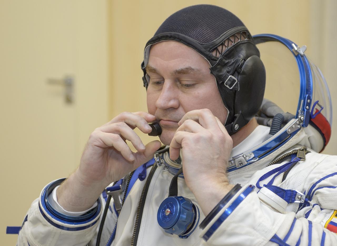 Expedition 59 cosmonaut Alexey Ovchinin of Roscosmos dons his Sokol suit prior to his launch on a Soyuz rocket with Nick Hague and Christina Koch of NASA, Thursday, March 14, 2019 at the Baikonur Cosmodrome in Kazakhstan. Hague, Koch, and Ovchinin launched March 14, U.S. time, on the Soyuz MS-12 spacecraft from the Baikonur Cosmodrome for a six-and-a-half month mission on the International Space Station Photo Credit: (NASA/GCTC/Irina Spector)
