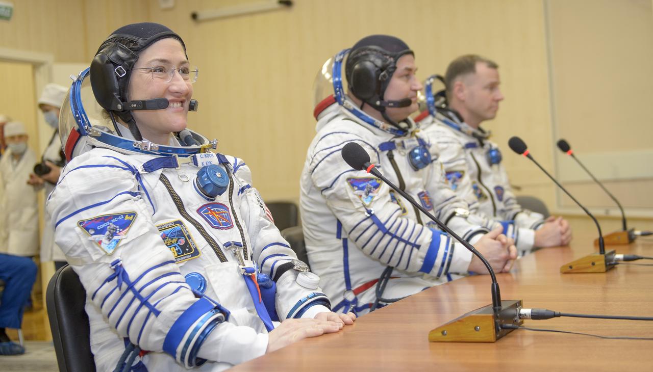 Expedition 59 crewmembers Christina Koch of NASA, left, Alexey Ovchinin of Roscosmos, and Nick Hague of NASA, right, talk with family and mission management prior to their launch, Thursday, March 14, 2019 at the Baikonur Cosmodrome in Kazakhstan. Hague, Koch, and Ovchinin launched March 14, U.S. time, on the Soyuz MS-12 spacecraft from the Baikonur Cosmodrome for a six-and-a-half month mission on the International Space Station. Photo Credit: (NASA/GCTC/Irina Spector)